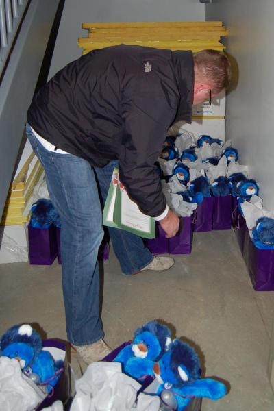 CCCF Volunteer getting ready to distribute the Ryan's Lions to the 110 families present
